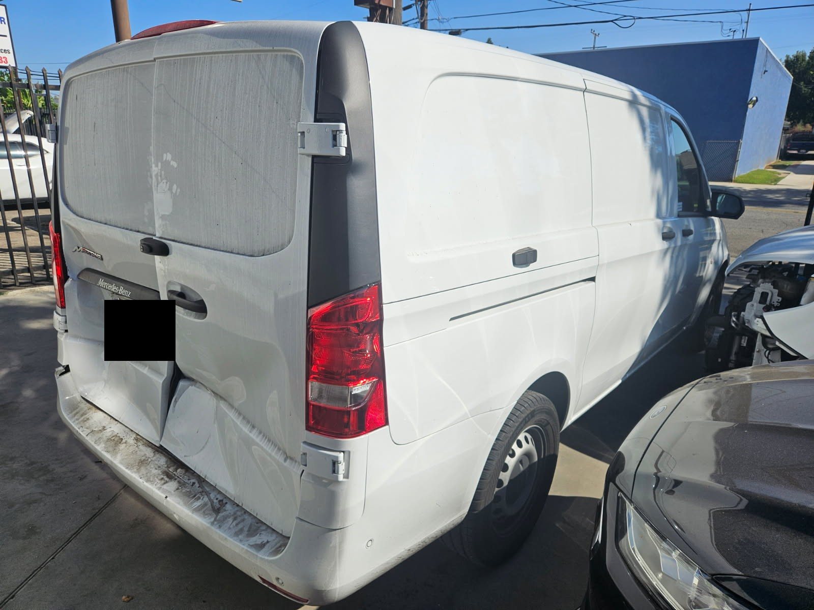 White commercial van before body repair at BG Auto Body